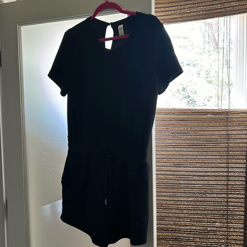 Air Essentials Short Sleeve romper in Black. Pristine condition size Large